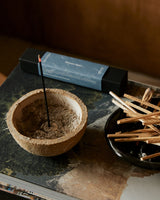 Earl of East Japanese incense sticks burning in a minimalist home setting with soft natural lighting
