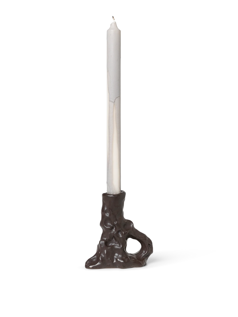 Single Dito Candle Holder, Dark Brown by ferm LIVING, holding a taper candle