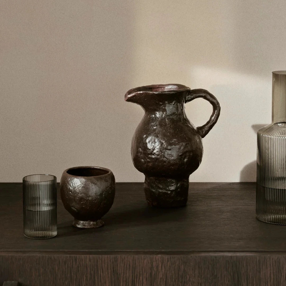 Doro Cup, Coffee by ferm LIVING, on a dark shelf
