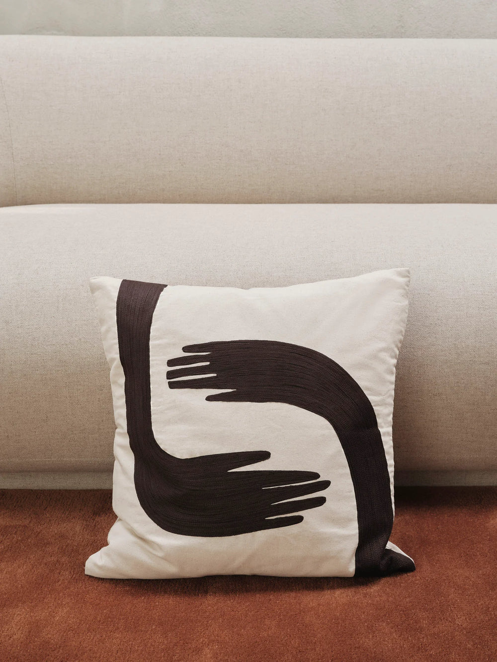 Pose Cushion by ferm LIVING, on a sofa