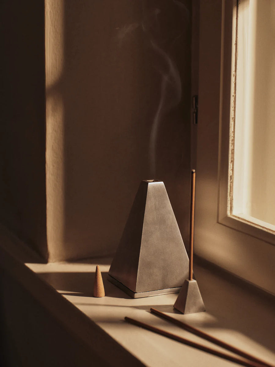 Pyra Incense Cone Burner, Brushed Aluminium by ferm LIVING, in warm shadowed light