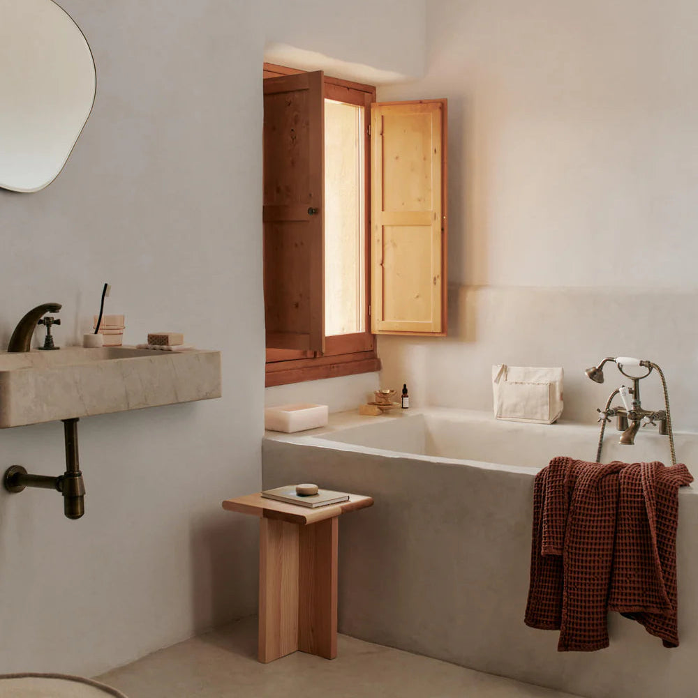 Mist Tissue Box, Pearl by ferm LIVING, in a bathroom with towels