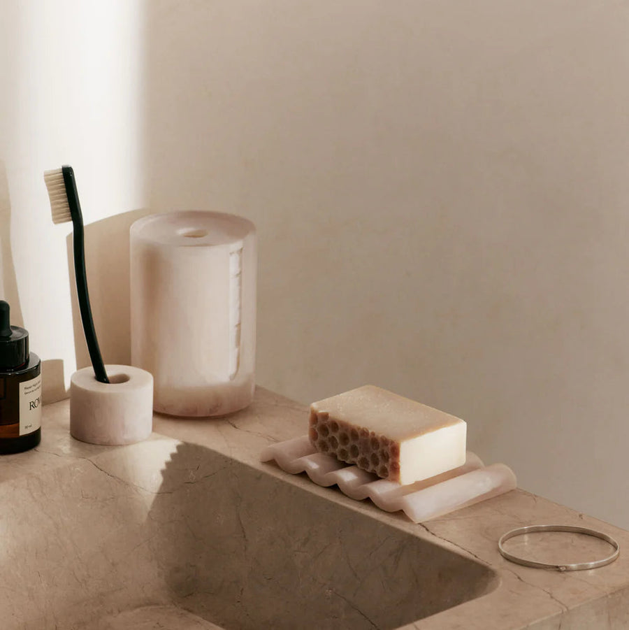 Mist Cotton Pad Holder, Pearl by ferm LIVING, on a stone basin