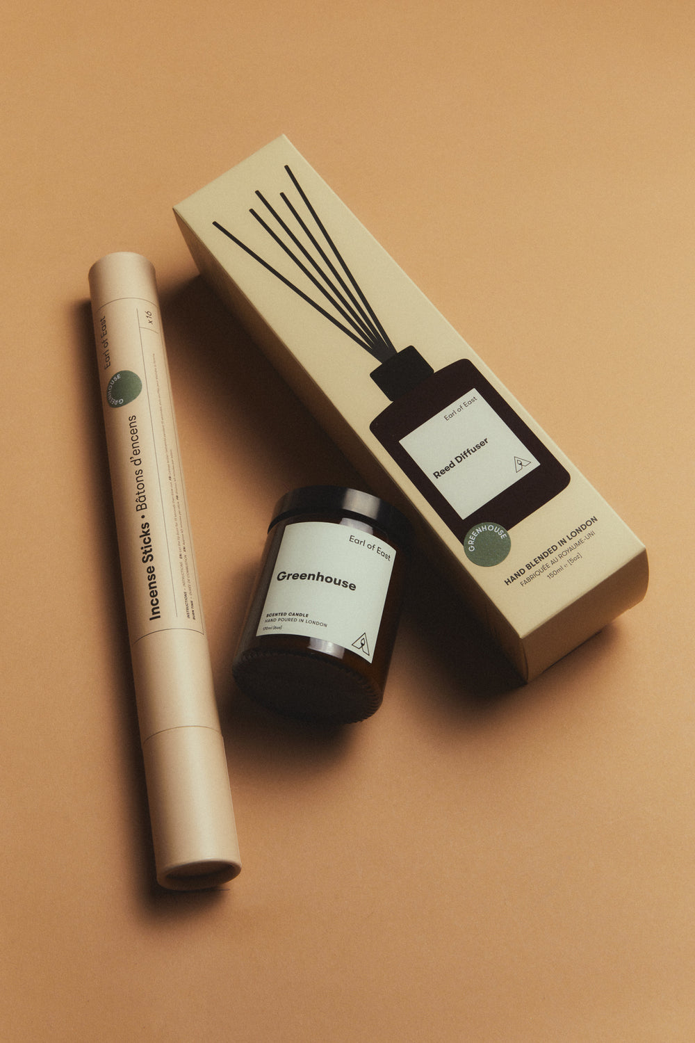 Greenhouse Scent Layering Set by Earl of East, on a tan background