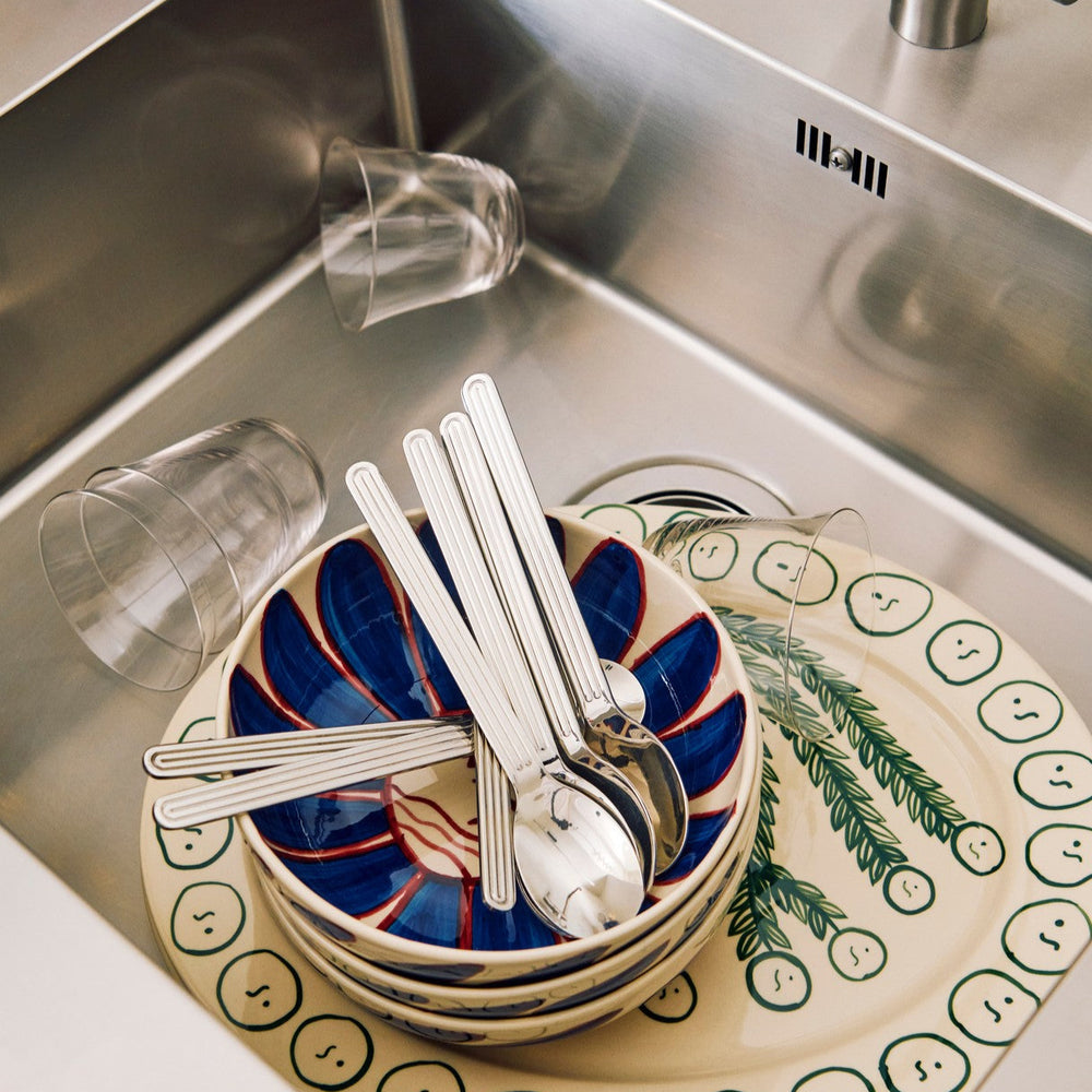 Curve Tumbler Glasses, Set of Two, Clear by HAY, in a dish rack with cutlery