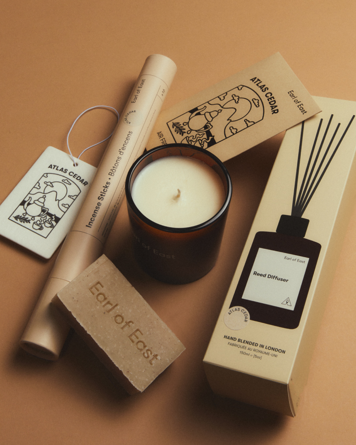 Atlas Cedar Signature Scent Bundle by Earl of East, bundle laid out on a tan backdrop