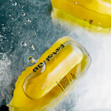 Shinrin-Yoku All Over Oil Bottle in Water, Showcasing the Yellow colour of the oil. 
