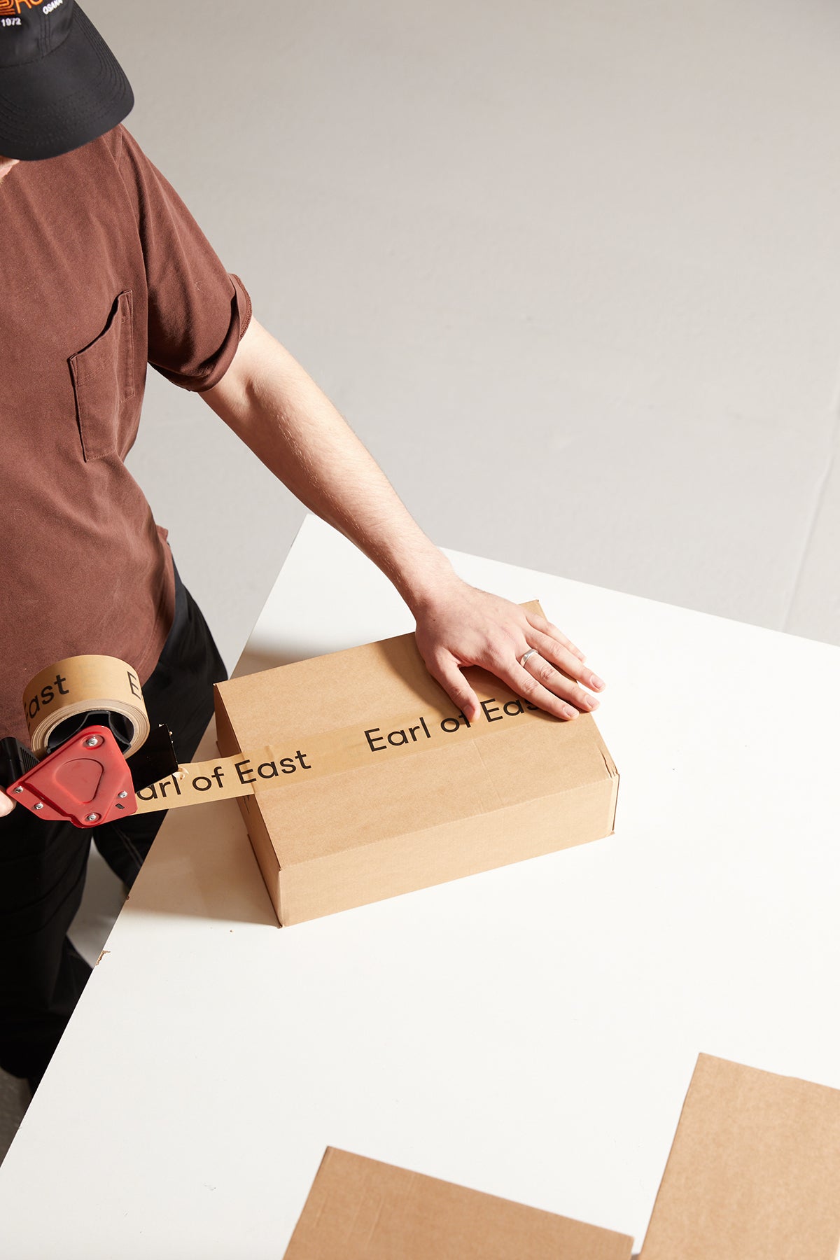 Person packing an Earl of East order at the studio