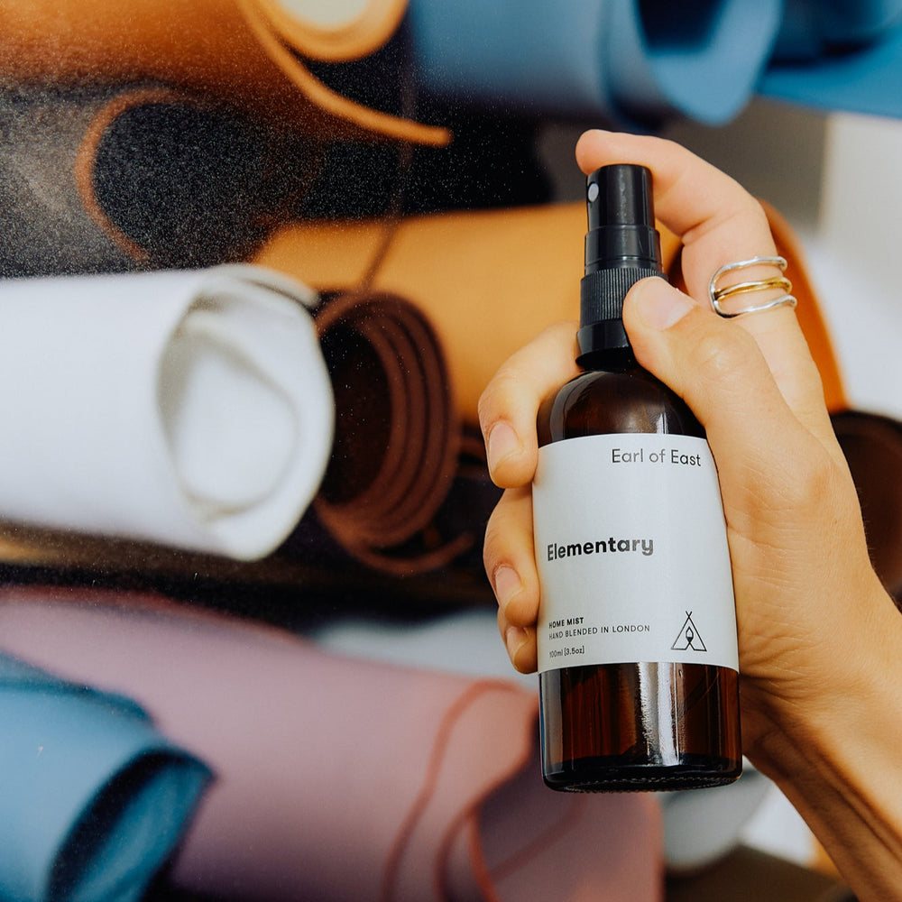 Home Mist, Elementary 100ml [3.5oz] by Earl of East, being sprayed over bedding