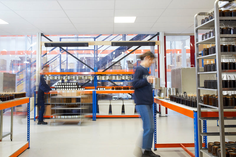 Earl of East team packing orders in the Leyton warehouse