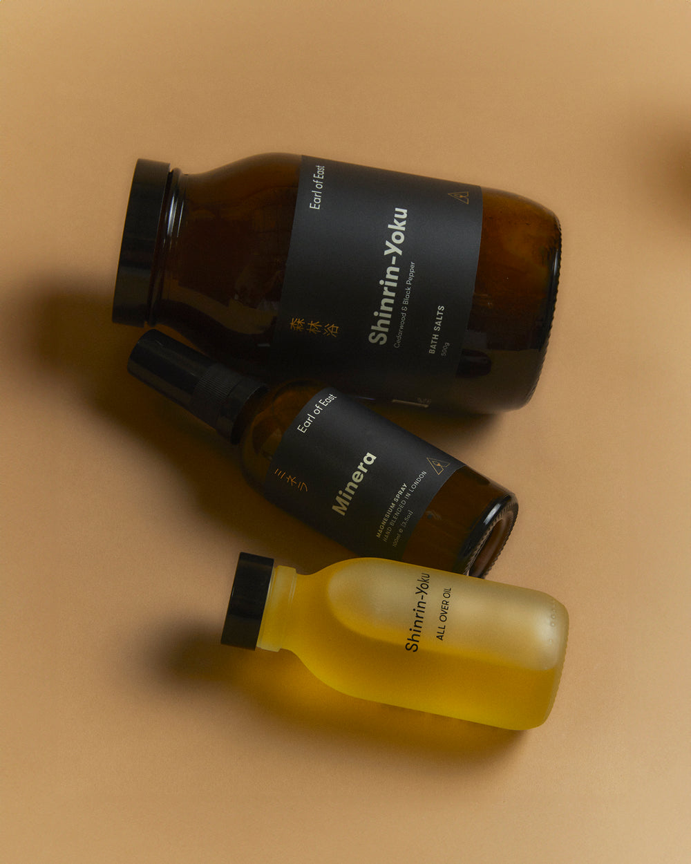 The Recovery Bundle by Earl of East, bottles on a tan background