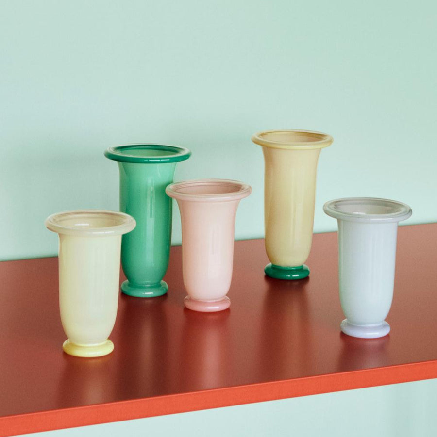 Empire Vase, Medium, Light Blue by HAY, in a range of colours on a red shelf
