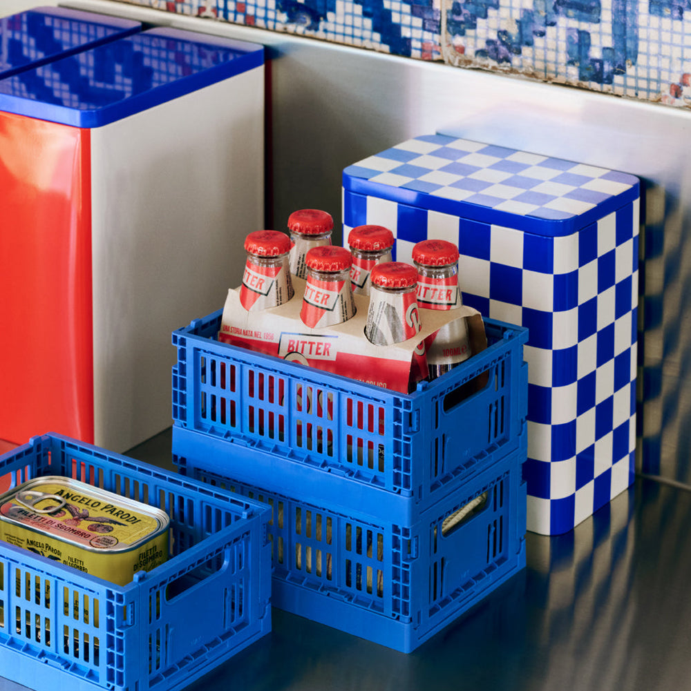 Tin Container, Large, Blue and Off-White by HAY, with blue crates of drinks