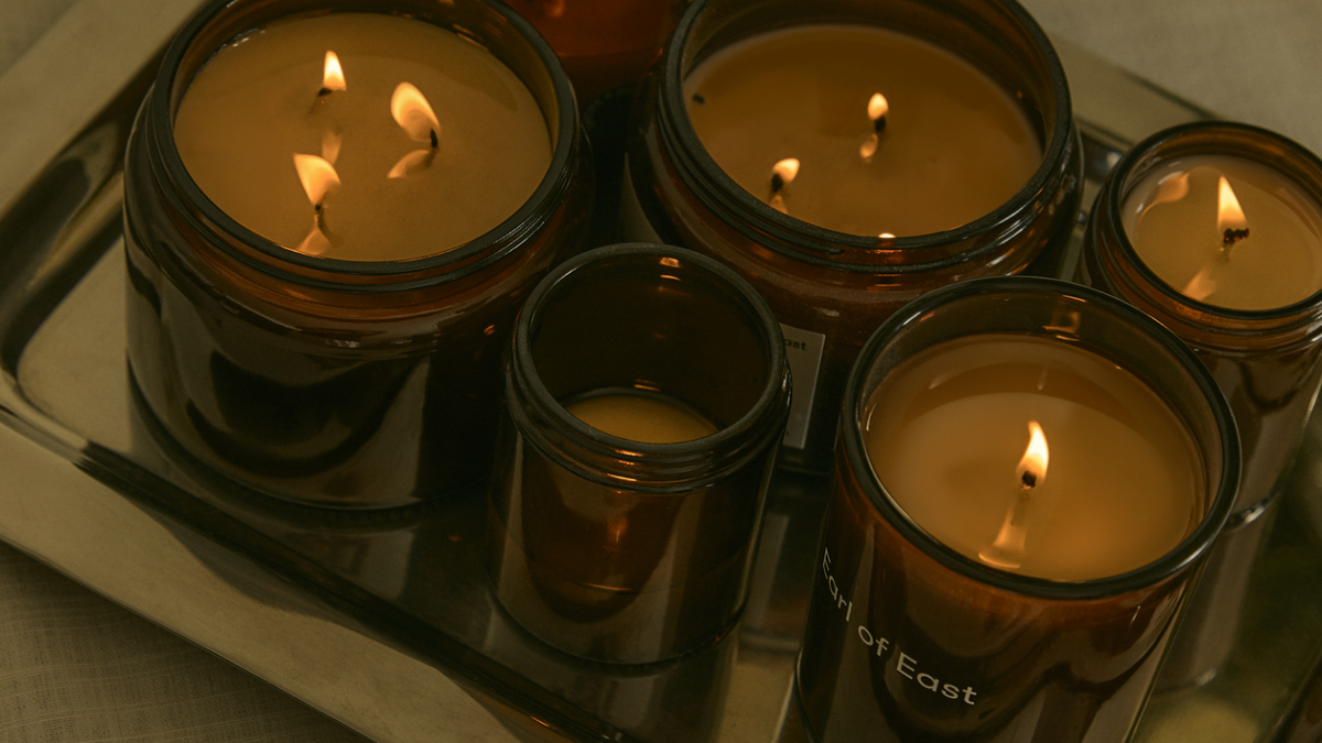 Earl of East Jardin de la Lune candles lit on a tray