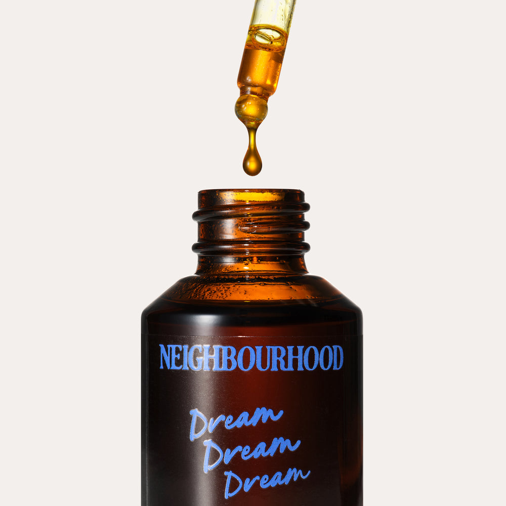 Dream Dream Dream Nightly Facial Oil, 30ml by Neighbourhood Botanicals, with oil dropping from the pipette