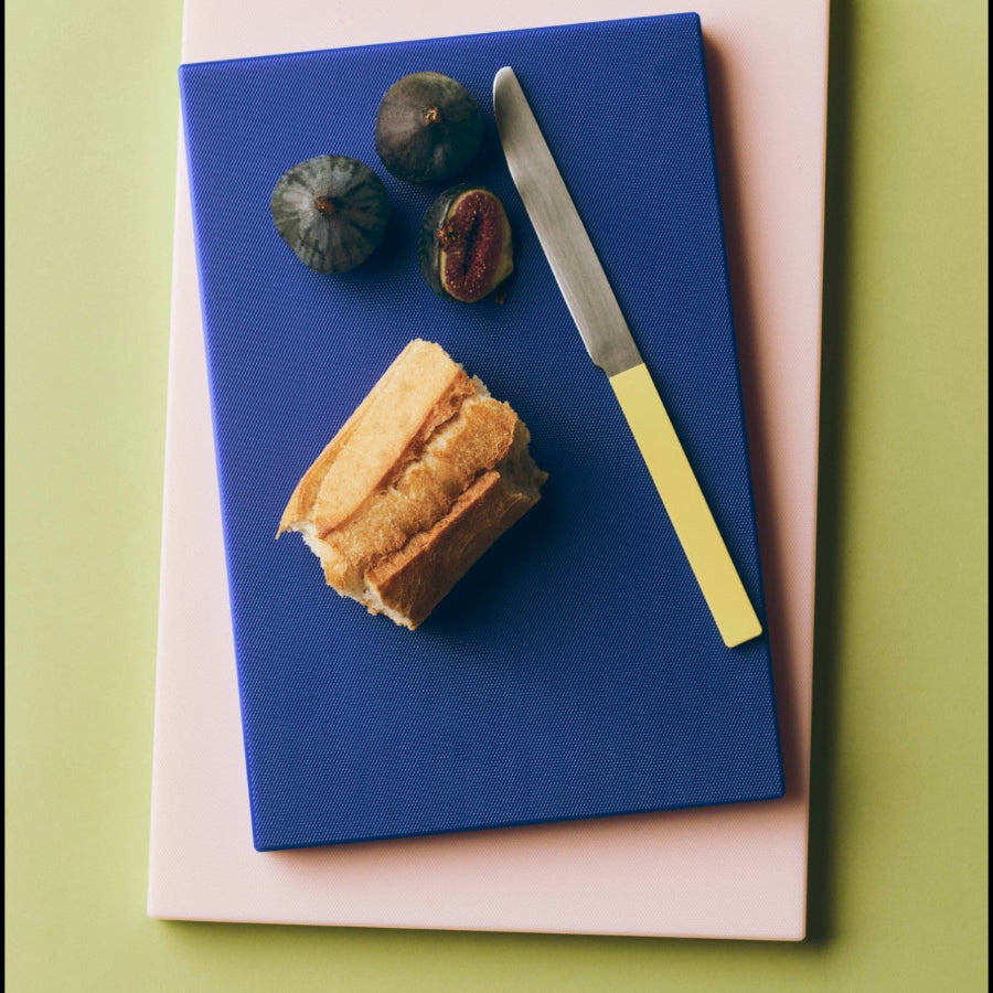 Chopping Board, Large, Baby Pink by HAY, with bread and a knife