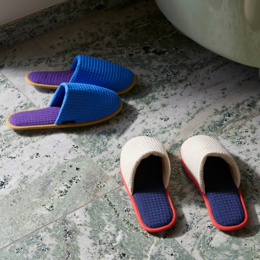 Waffle Slippers, Blue Multi by HAY, on a rug