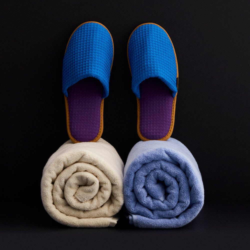 Waffle Slippers, Blue Multi by HAY, with rolled towels