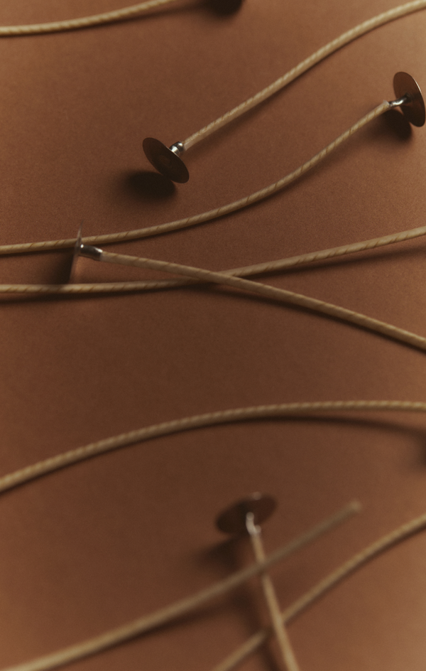 Candle wicks on a brown surface