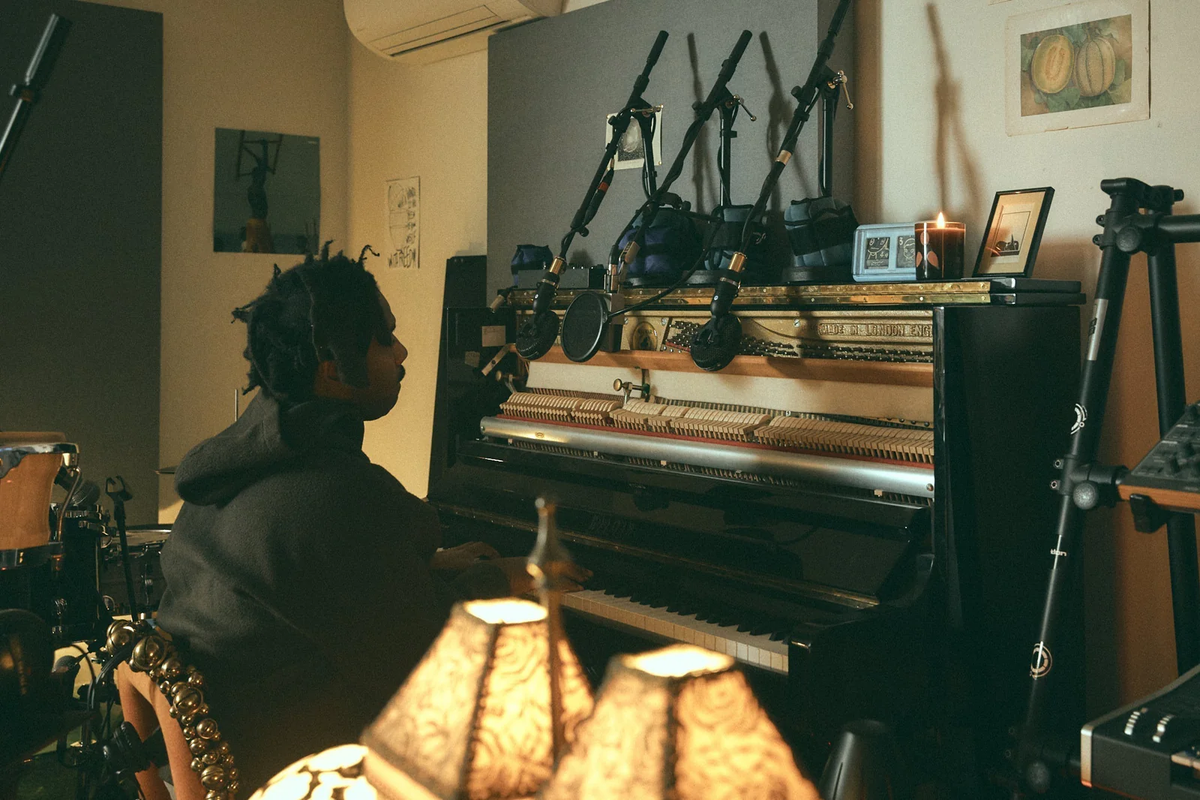 Music studio with a piano, guitars and warm lamps