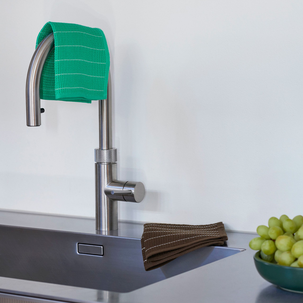 Canteen Dish Cloth Set of 2, Chocolate/Emerald Pinstripe by HAY, draped over a kitchen tap