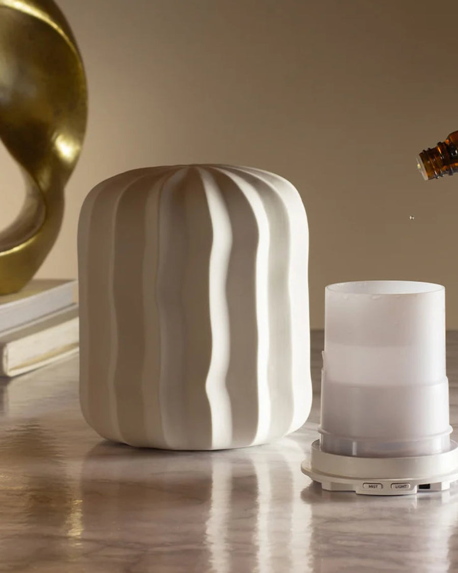 Lina Aroma Diffuser by Made by Zen, on a beige shelf