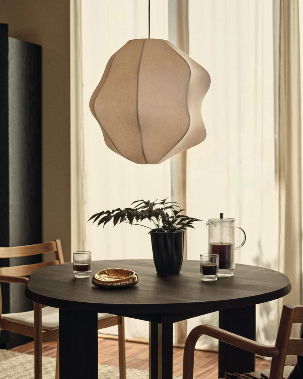 Dedali Vase, Medium / H18, Dark Brown by ferm LIVING, on a dining table under a paper lamp