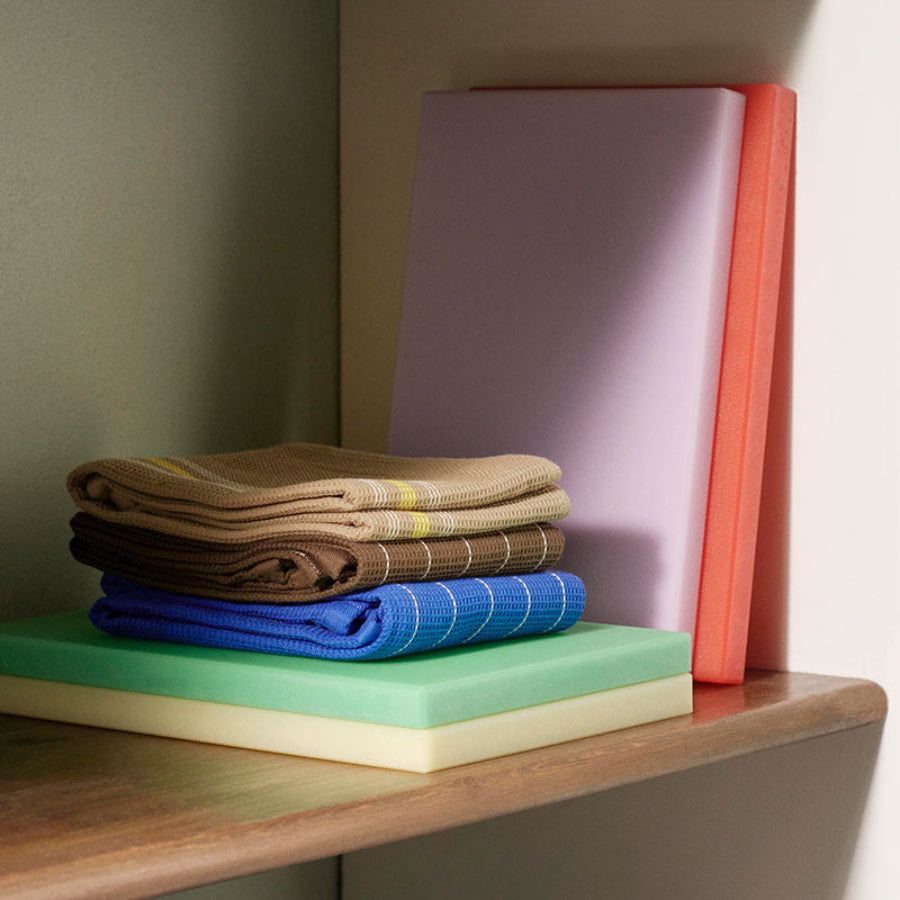 Chopping Board, Large, Baby Pink by HAY, stacked in a range of colours on a shelf