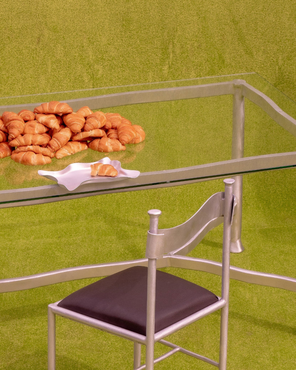 Paper Tray, Aluminium by Six Dots Design, holding food on a glass table