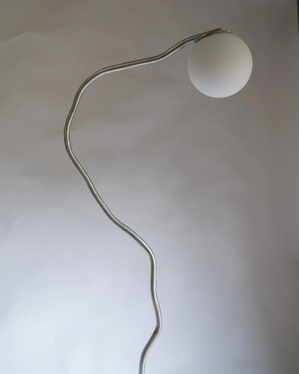 Pea Head Lamp, Aluminium by Six Dots Design, on a grey background