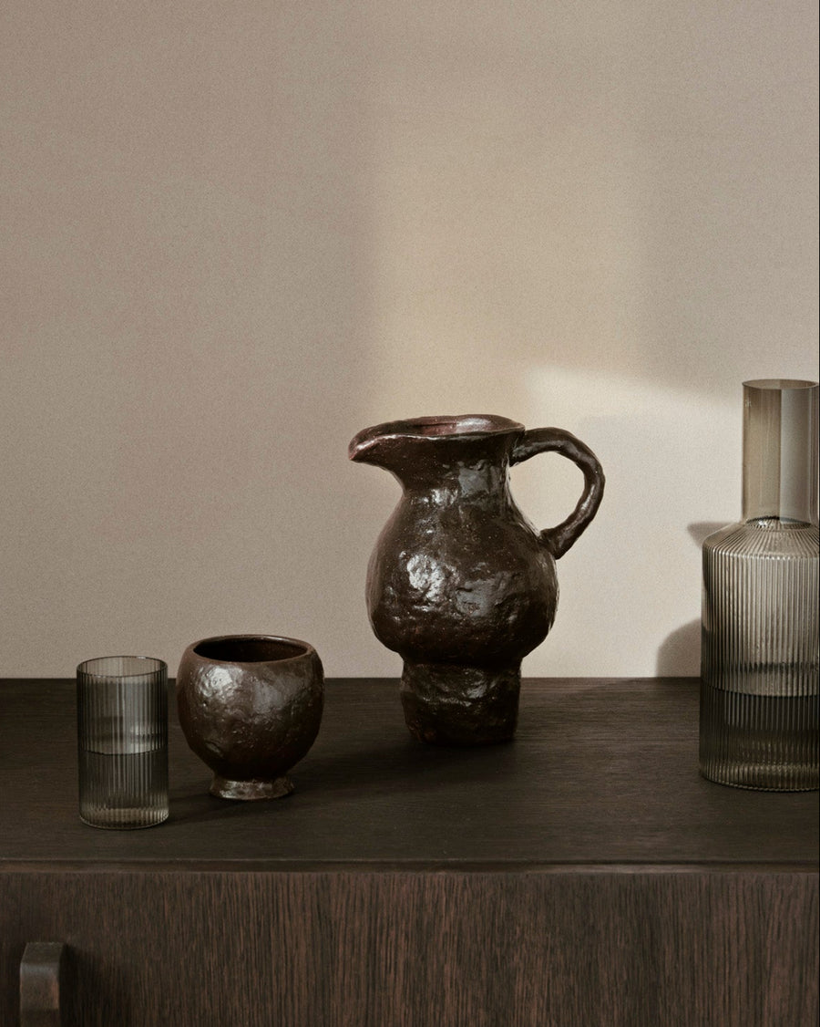 Doro Jug, Coffee by ferm LIVING, on a dark sideboard