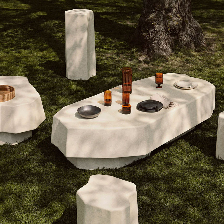 Staffa Coffee Table, Large, Ivory by ferm LIVING, set outdoors on moss