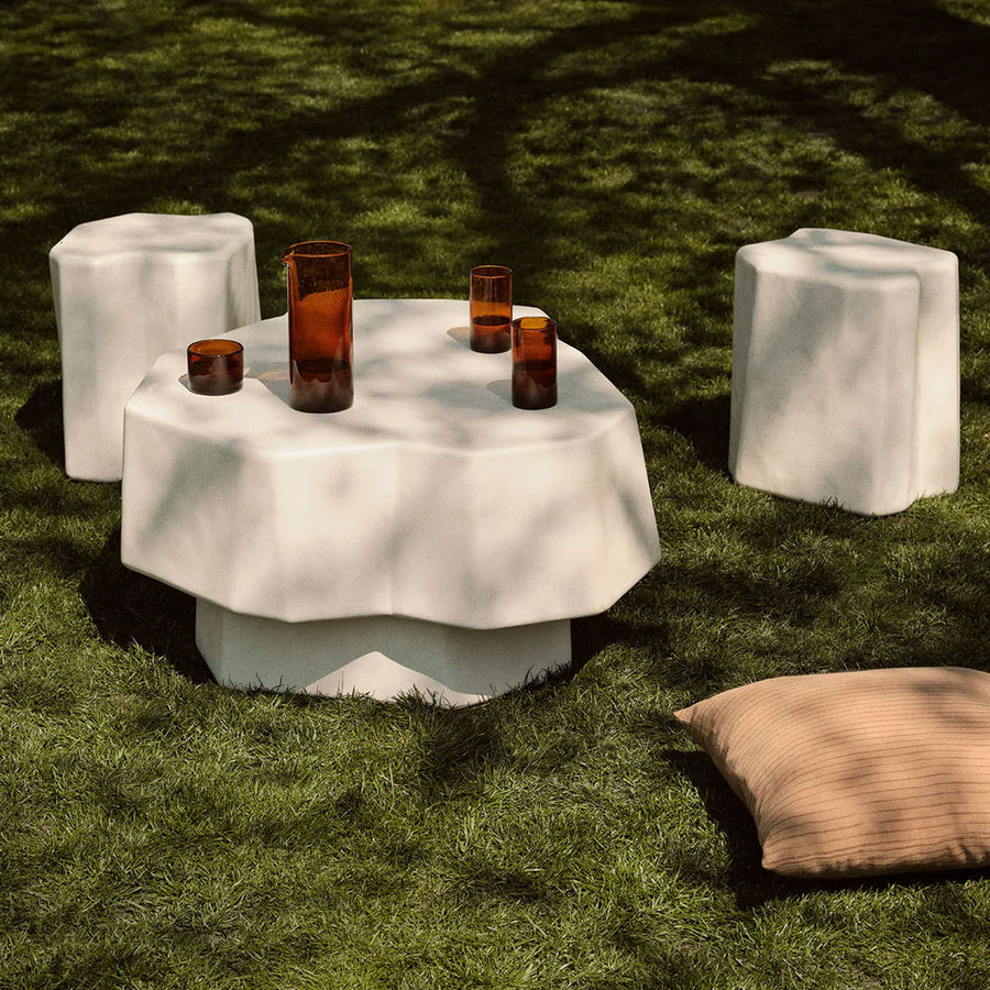 Staffa Stool, Ivory by ferm LIVING, set outdoors on moss