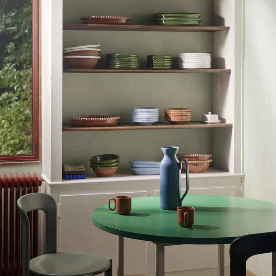 Barro Bowl, Set of Two, Light Blue by HAY, on a green table in a kitchen