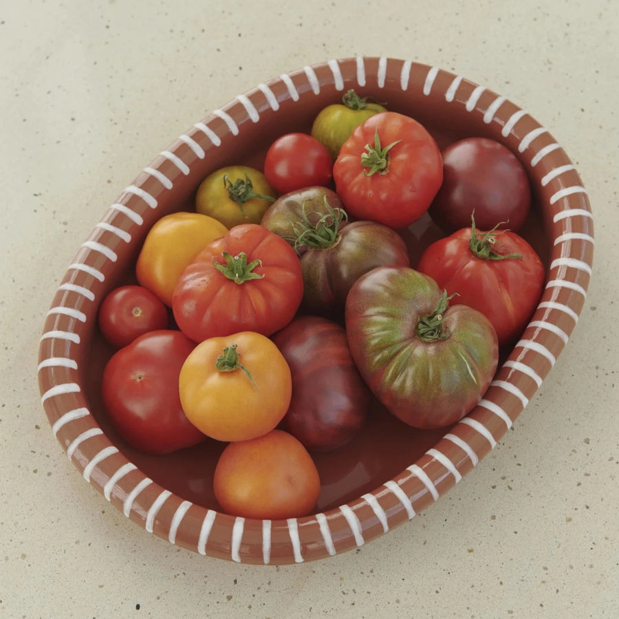 Barro Oval Dish, Large, Natural with Stripe by HAY, filled with tomatoes
