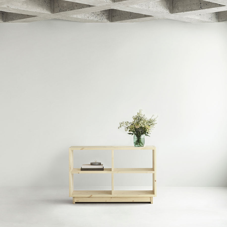 Fyr Bookcase, Pine, Low by Normann Copenhagen, in a white room