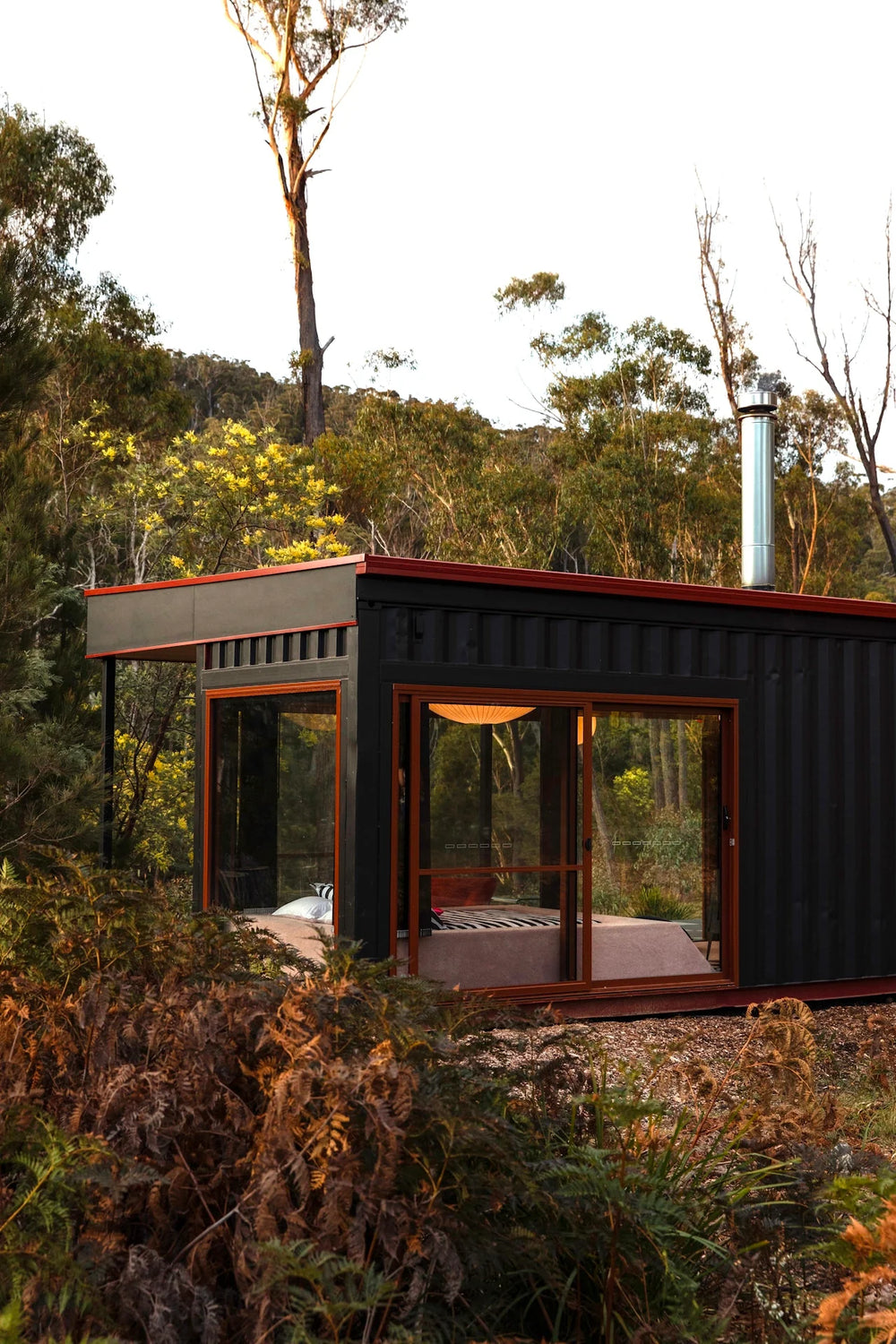 Surf Shacks by Gestalten, example spread showing a black cabin