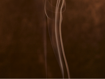 Incense smoke against a dark brown background