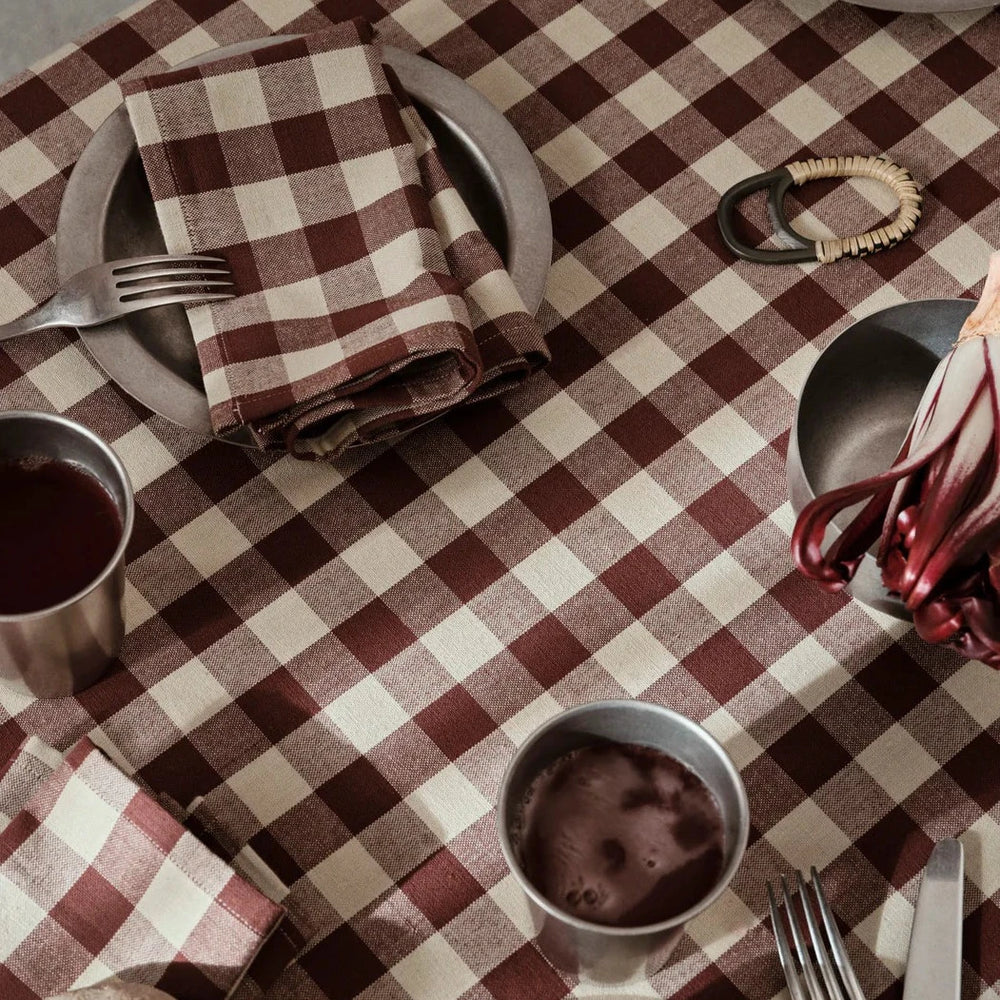 Tumbled Bowl, Stainless Steel by ferm LIVING, on a red gingham tablecloth