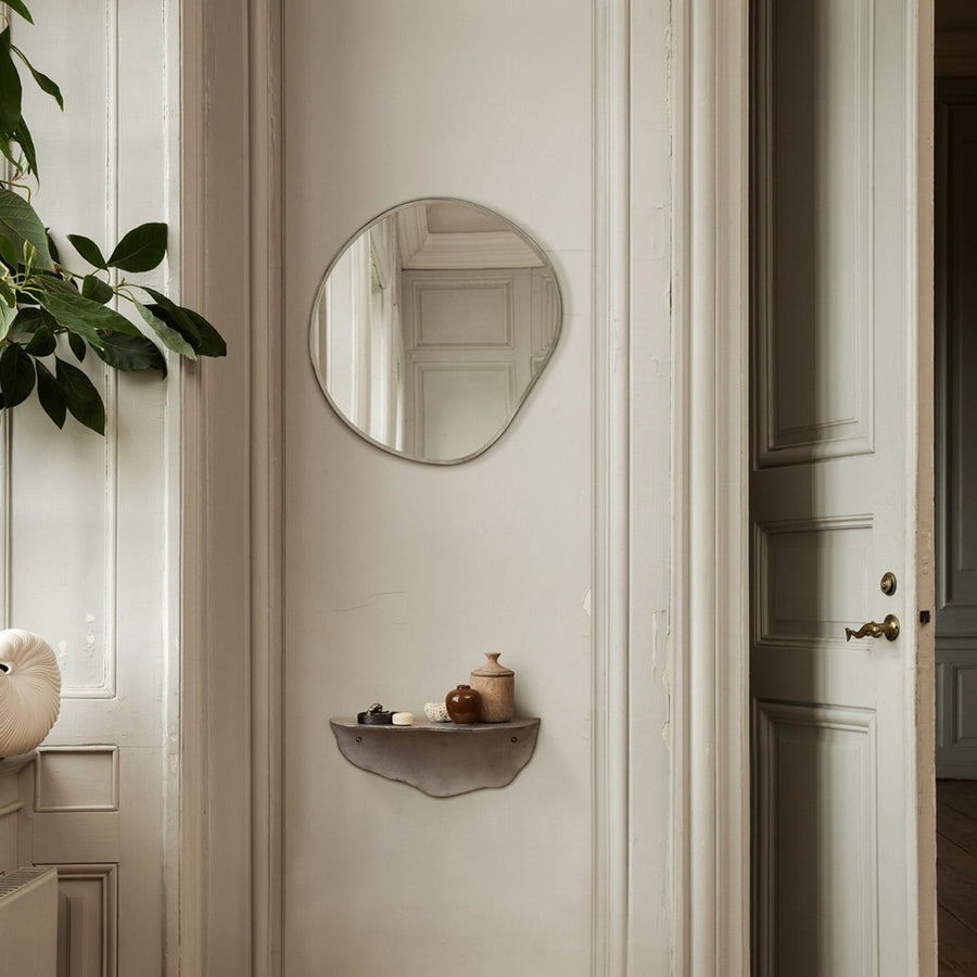 Pond Mirror, Small, Brass by ferm LIVING, in a hallway