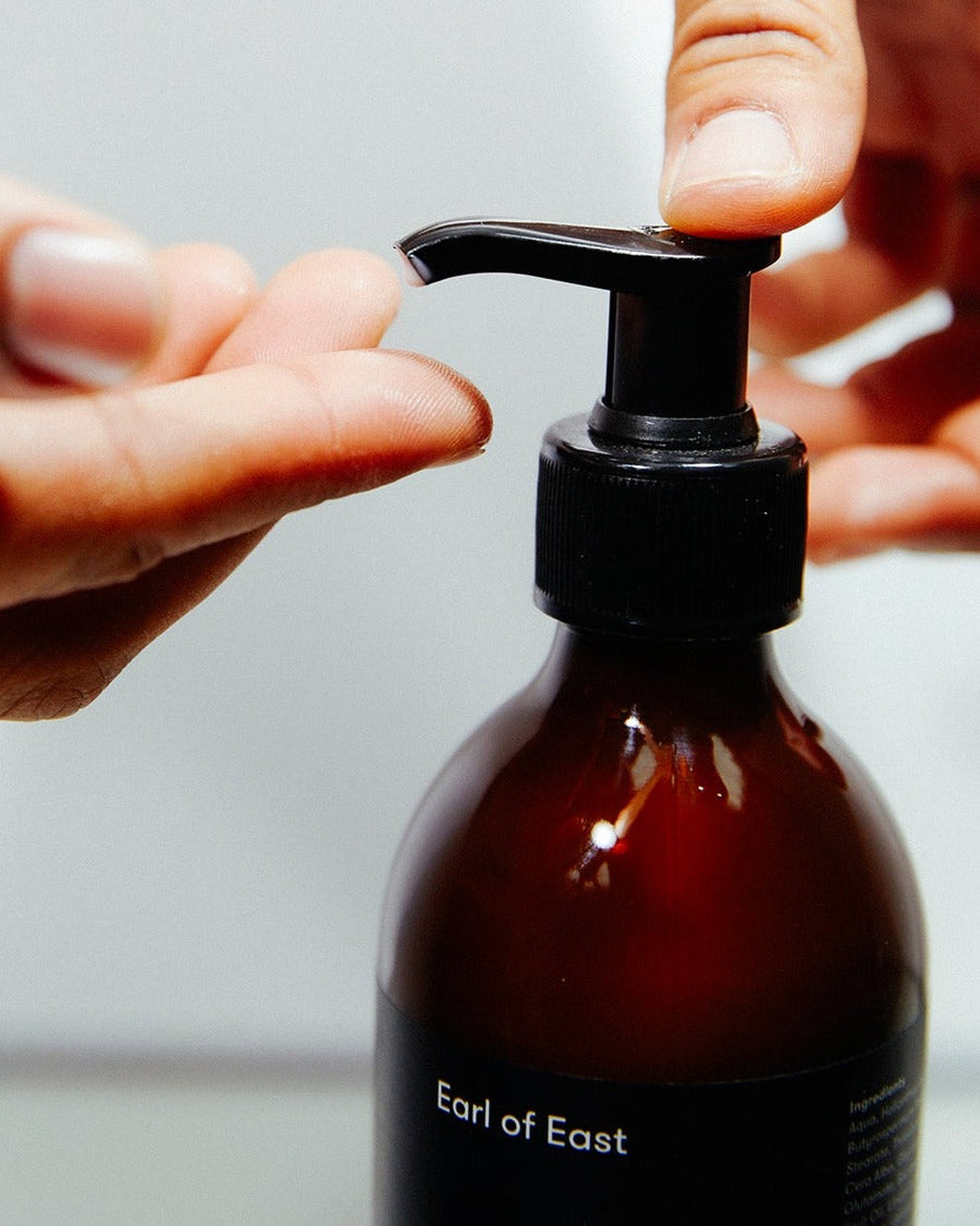 Onsen Hand Balm, 300ml by Earl of East, being dispensed into a hand