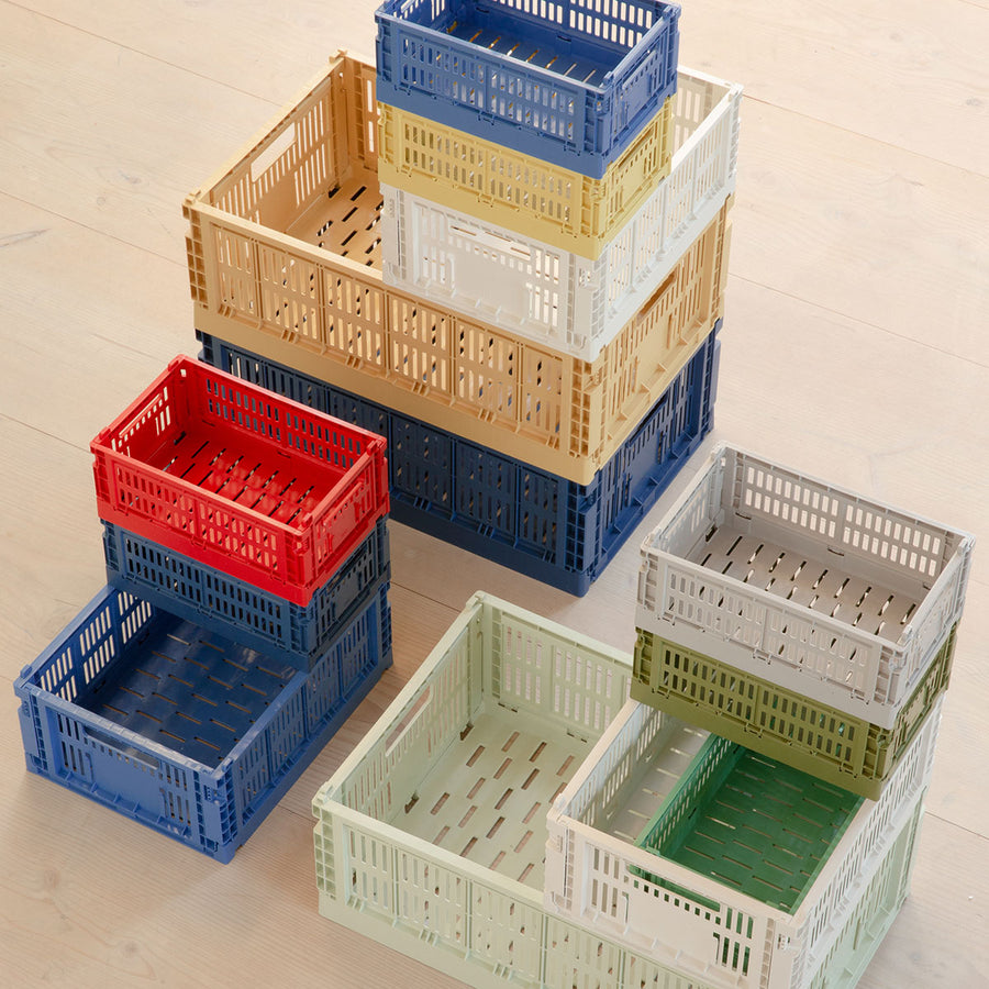 Colour Crate, Small, Off White by HAY, stacked in a range of colours