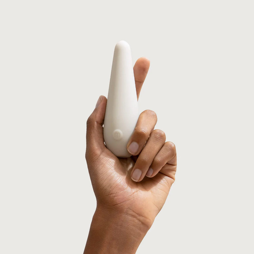 Vibe Personal Massager, Grey by Maude, held in hand