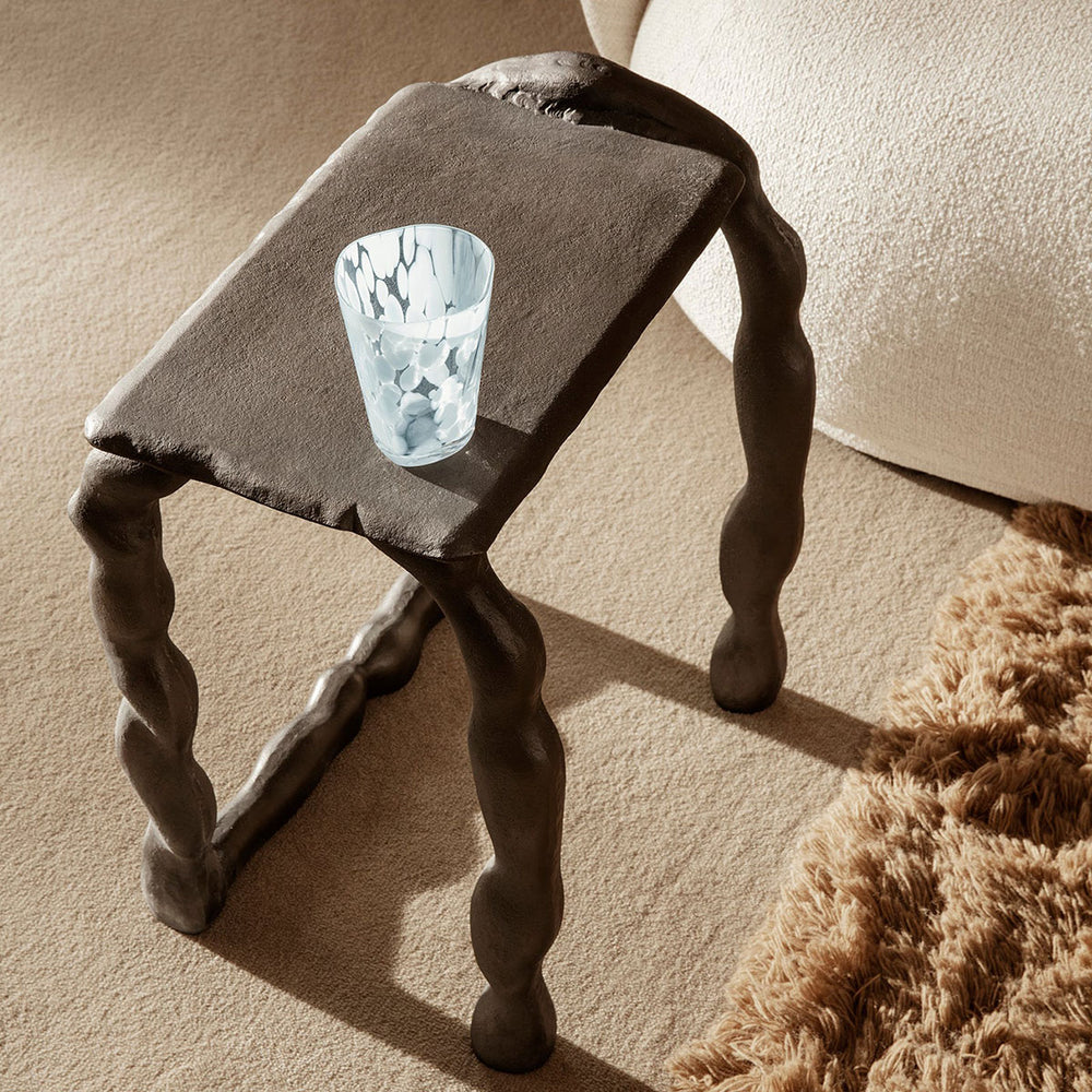 Rotben, Sculptural Table Piece by ferm LIVING, holding a book