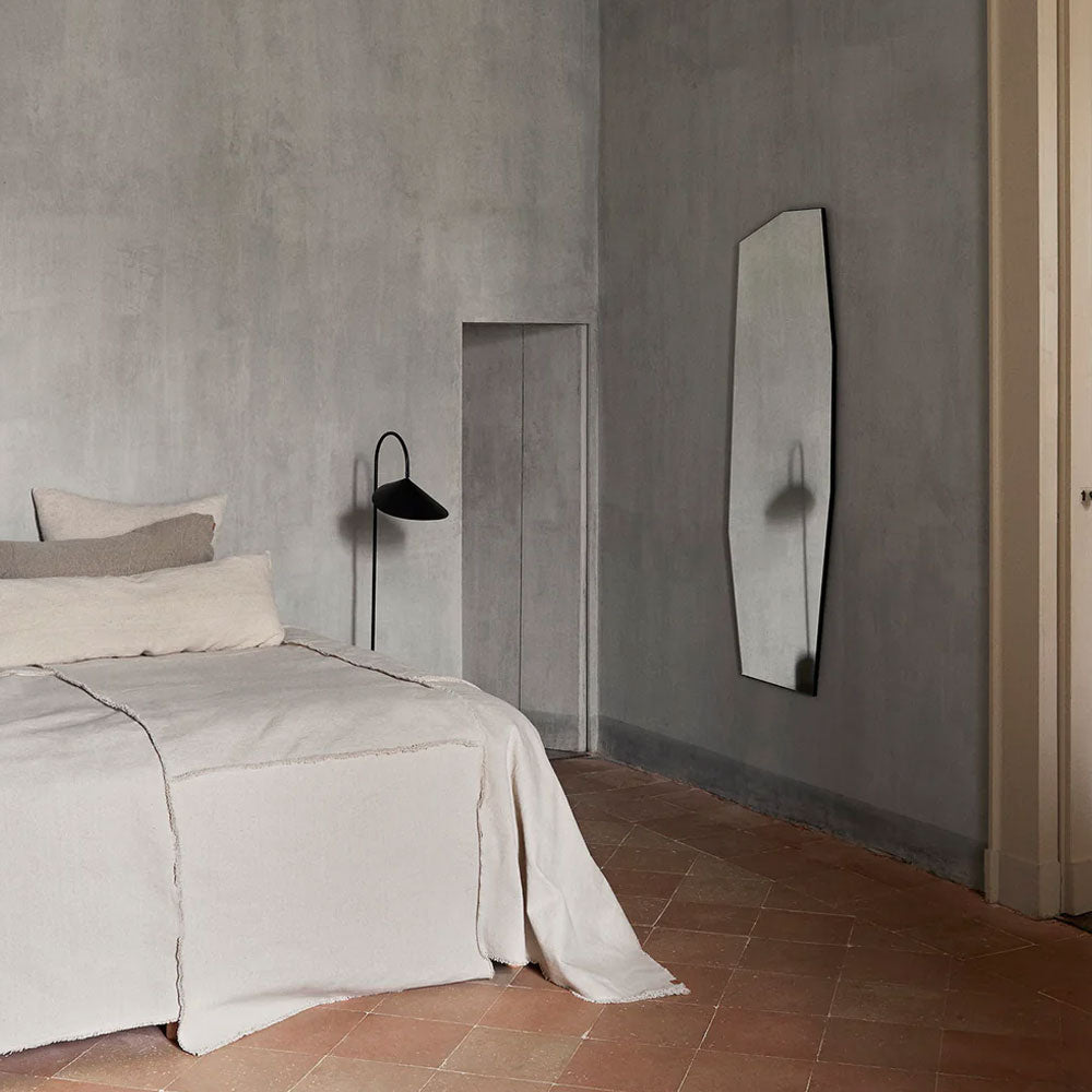 Shard Mirror, Full Size by ferm LIVING, leaning in a bedroom