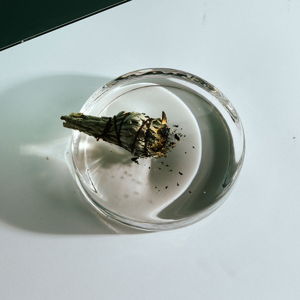 Sage Bundle by Earl of East, smouldering in a glass dish